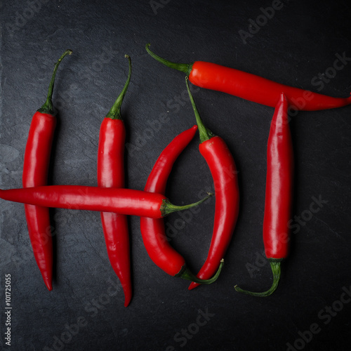 Canvas Print Hot chilies on slate