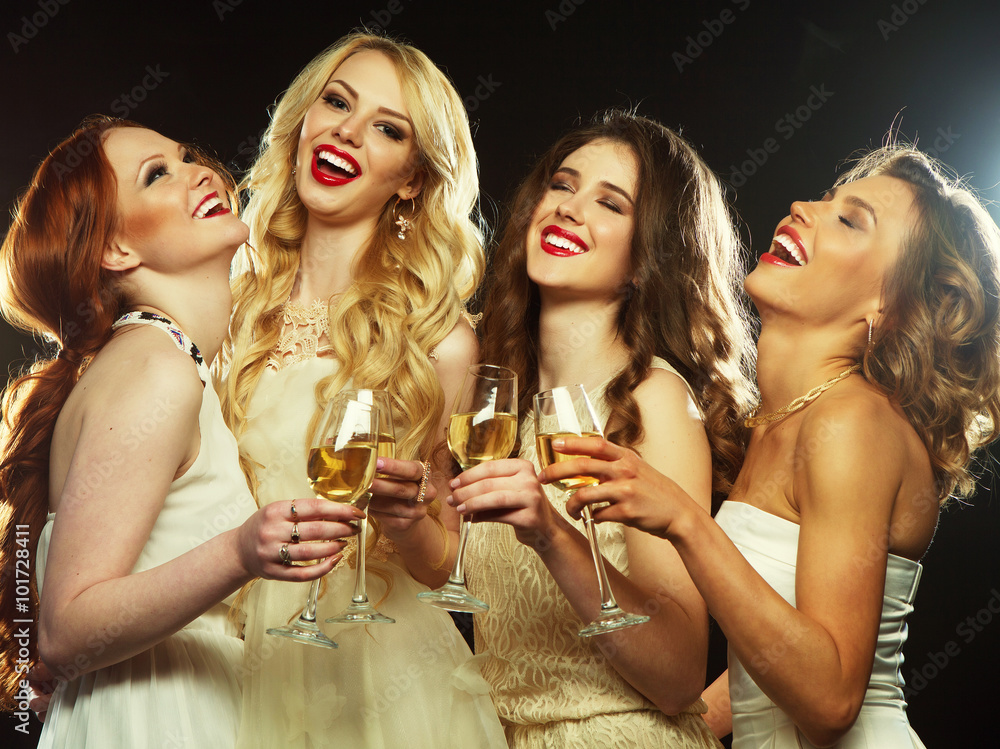 party  girls clinking flutes with sparkling wine