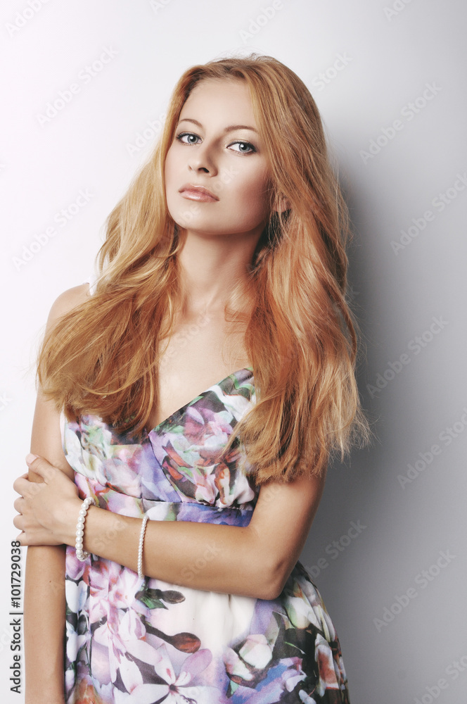 portrait of the young beautiful woman on a light background in a color dress portrait of the young beautiful woman on a light background in a color dress