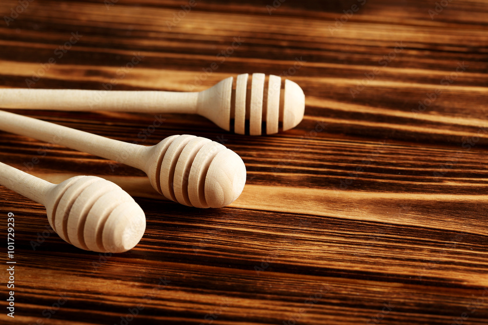 wooden honey dipper on a wooden table wooden honey dipper on a wooden table