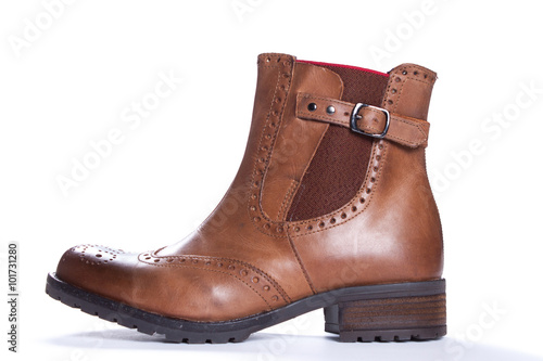 Womens brown suede fashion boots isolated with sample text. Shot