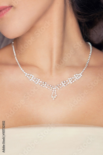 necklace on the woman's neck