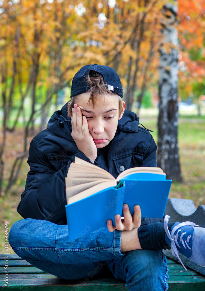 Fototapeta premium Displeased Teenager with the Book