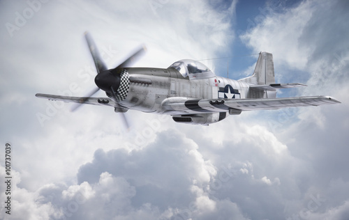 Billede på lærred World War II era fighter flies among clouds and blue sky