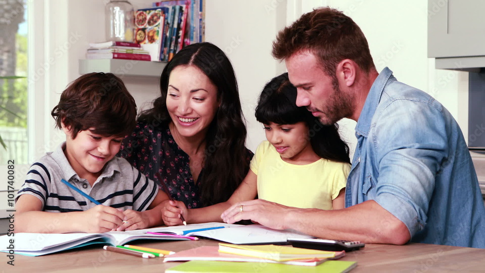 Parents assisting children doing homework Parents assisting children doing homework