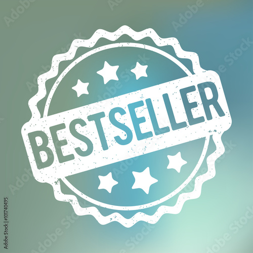 Bestseller rubber stamp white on a blue bokeh fog background.