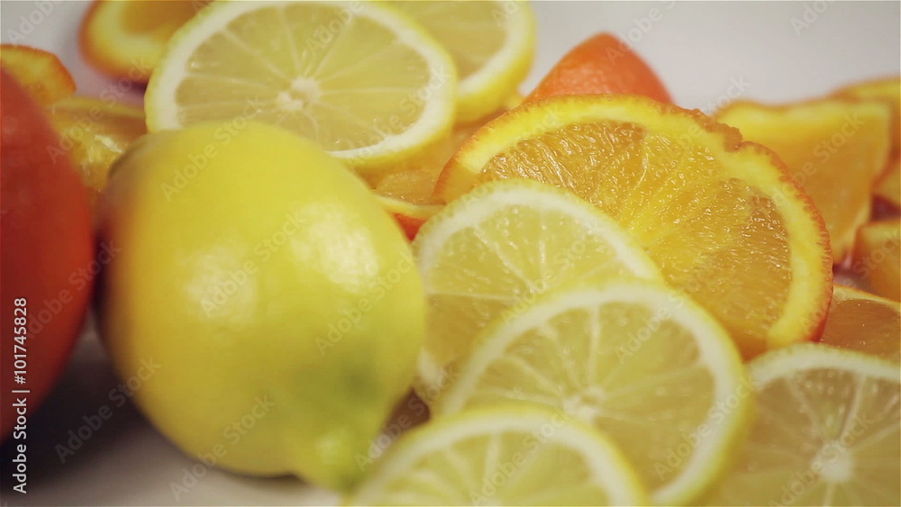 orange and lemon rotation on the table, close-up orange and lemon rotation on the table, close-up