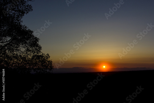 Sunset on a dark horizon