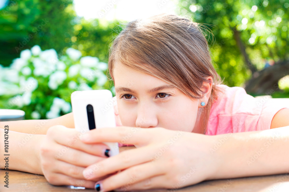Teenage problems. Young girl addicted to social media technologi Teenage problems. Young girl addicted to social media technologi