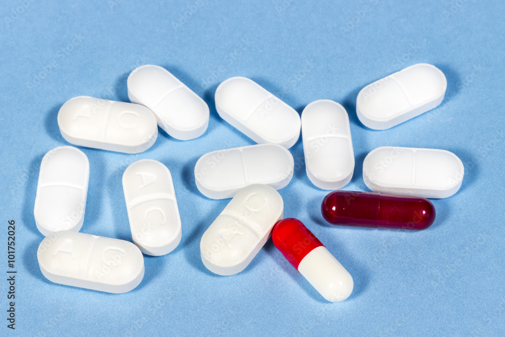 White tablets of generic drugs and hard gelatin capsules White tablets of generic drugs and hard gelatin capsules