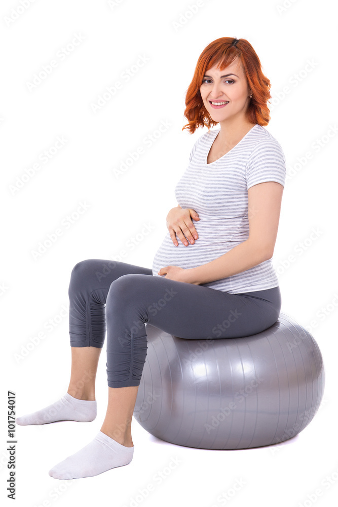 young pretty pregnant woman doing exercises on fitball isolated young pretty pregnant woman doing exercises on fitball isolated