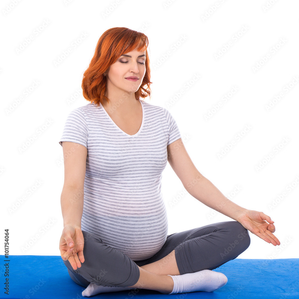 young pretty pregnant woman doing yoga isolated on white young pretty pregnant woman doing yoga isolated on white