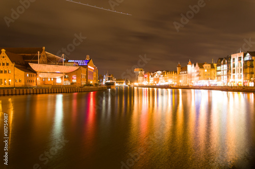 Cityscape of Gdansk over the Motlawa river by night, Poland.
