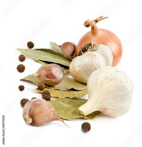 garlic, onion, pepper spice on laurel leaf isolated