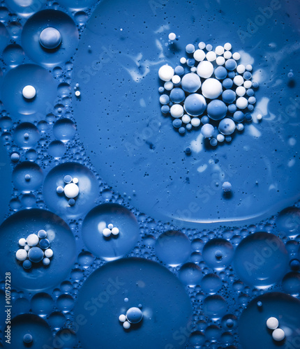 blue colored bubbles in oil