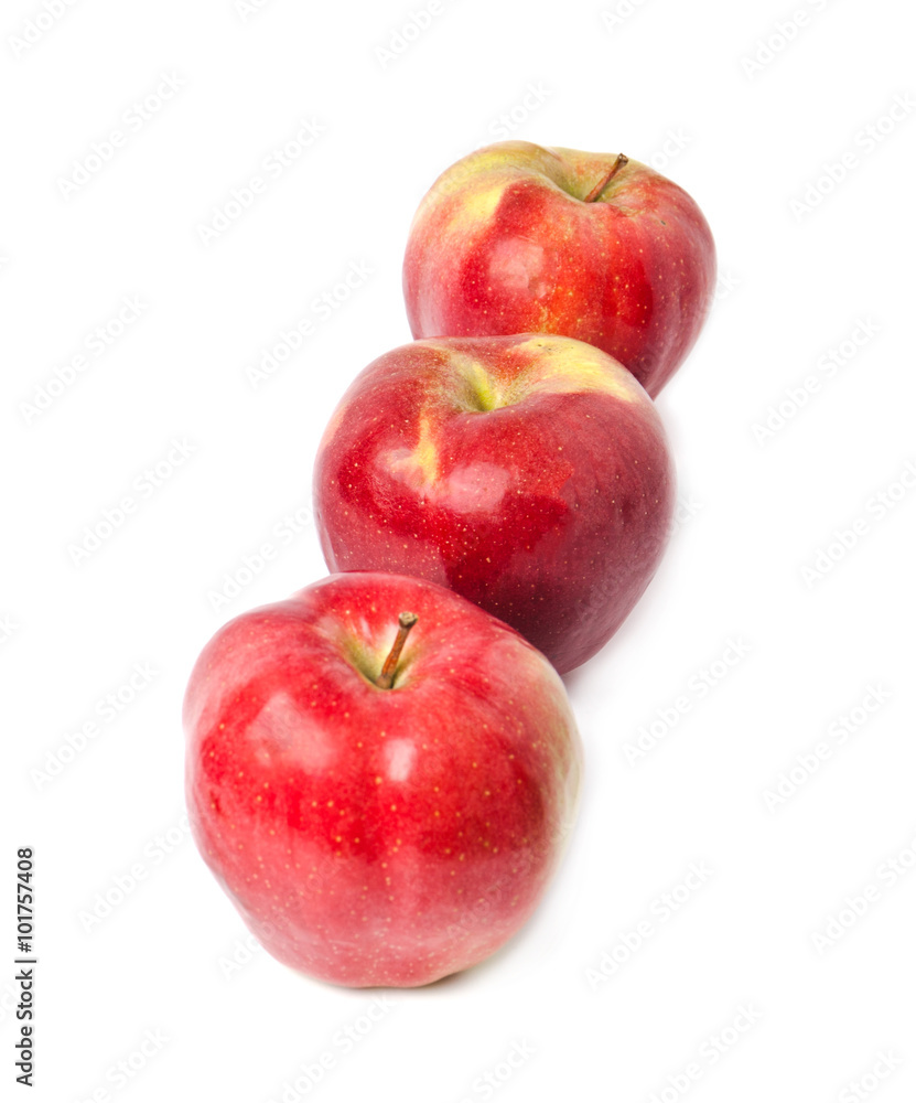 three red apples on a white background three red apples on a white background