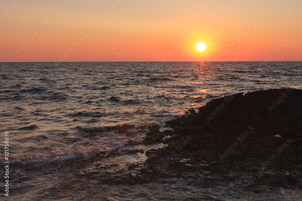 Fototapeta premium Sunset over the sea during summer evening in Croatia