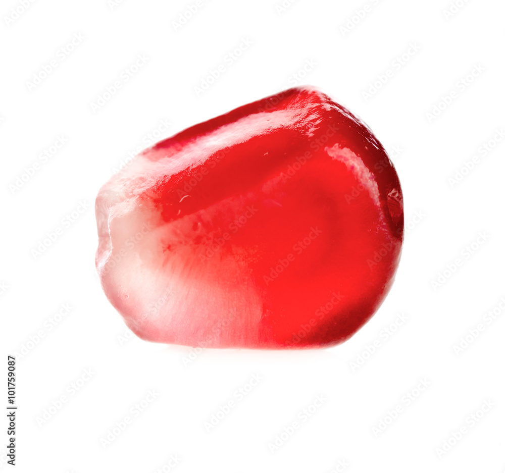 one grain of pomegranate macro on a white background one grain of pomegranate macro on a white background