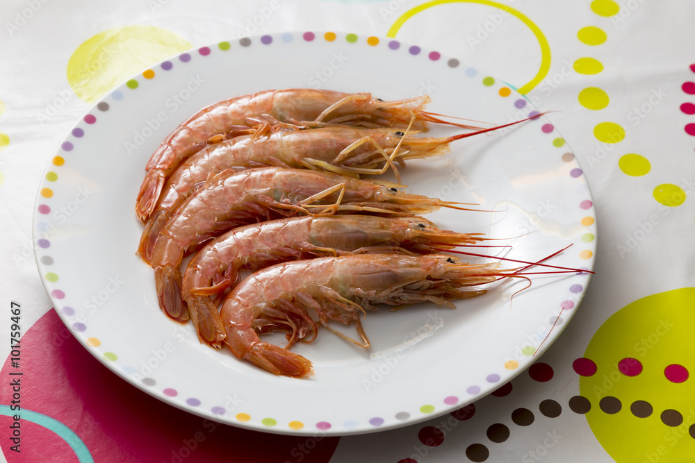 plate with raw prawns plate with raw prawns