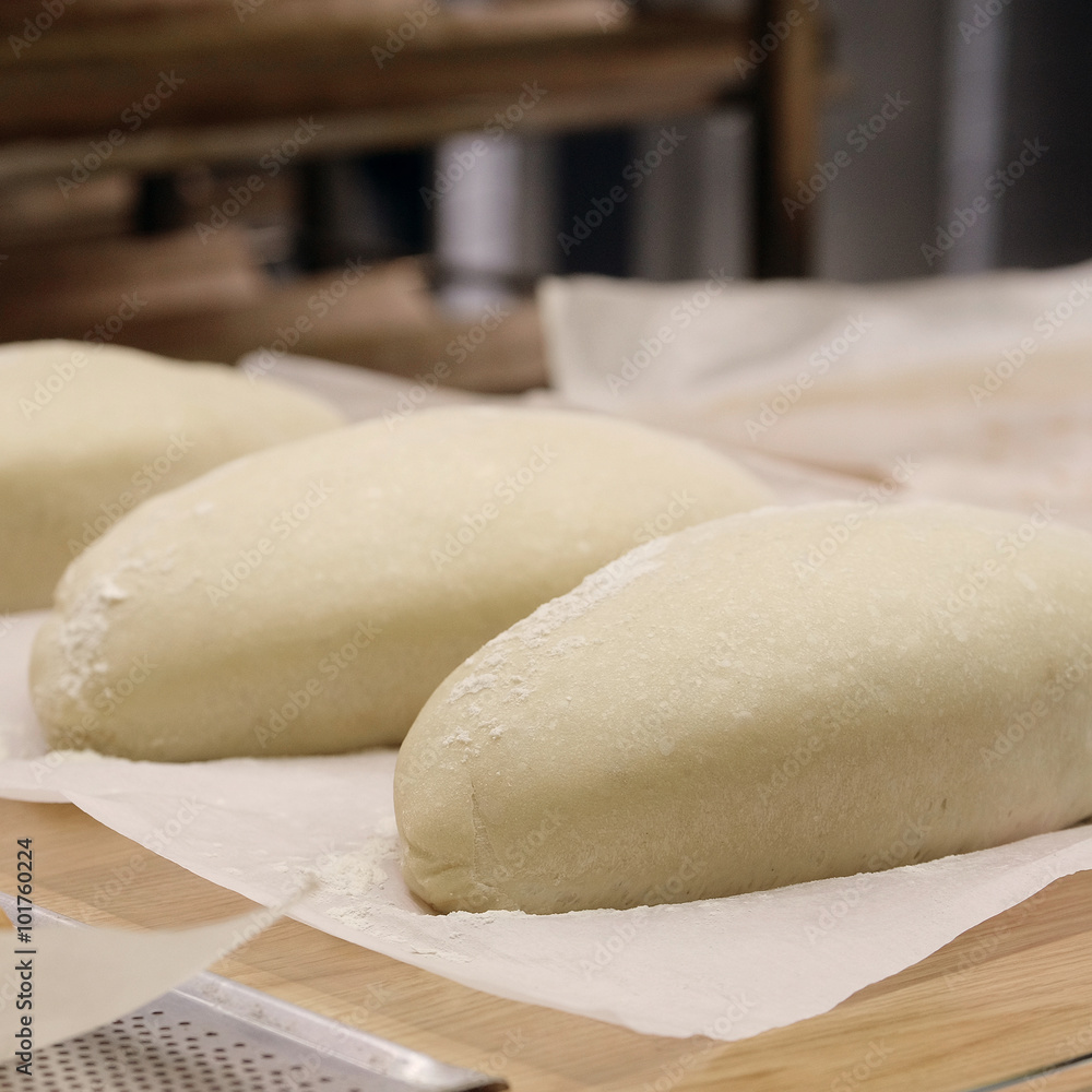 Bread before placing in hot oven. Bread before placing in hot oven.