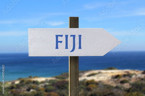 Fiji sign with seashore in the background