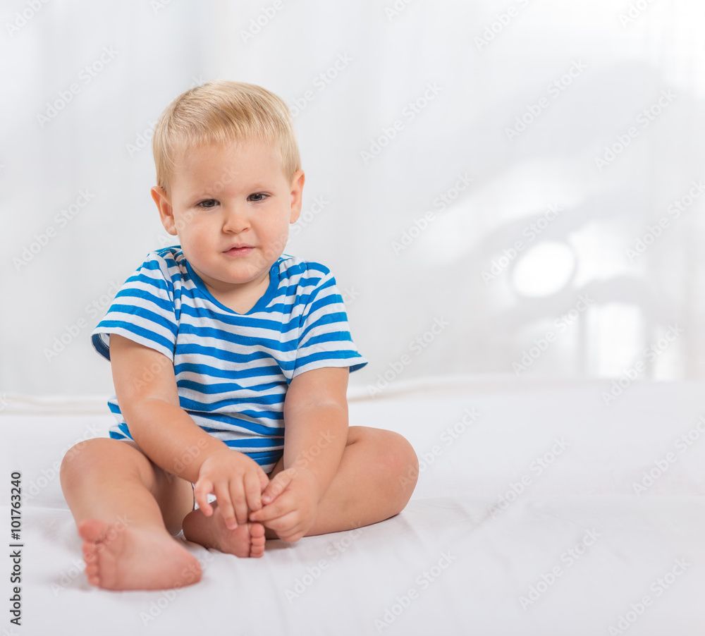 Portrait sitting baby boy isolated on white space for text Portrait sitting baby boy isolated on white space for text