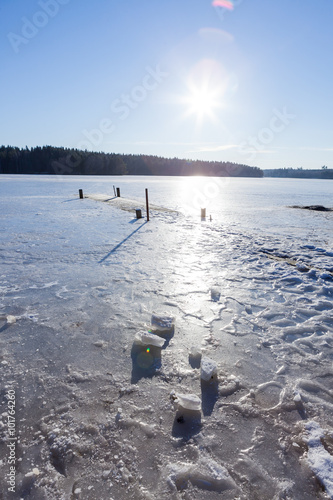 Frozen old pier at winter morning photo