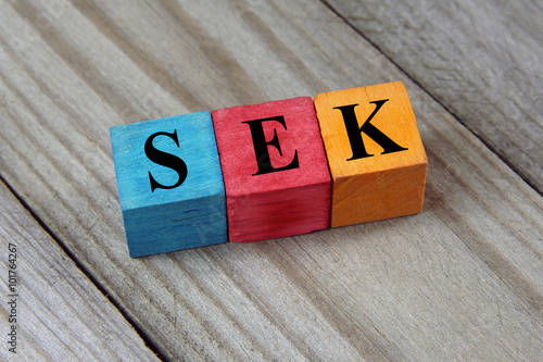 SEK (Swedish Krona) sign on colorful wooden cubes