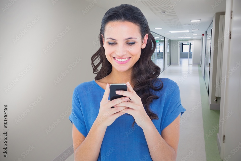 Composite image of pretty brunette sending a text Composite image of pretty brunette sending a text
