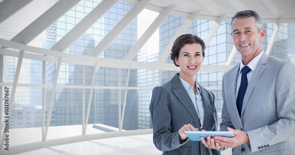 Fotografie Composite image of business team using tablet pc