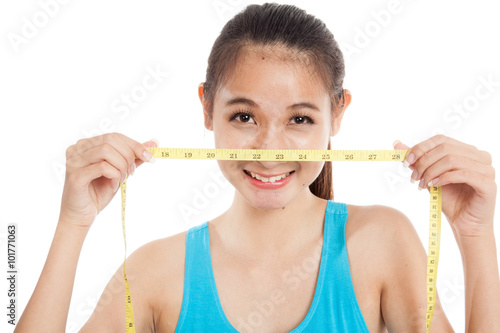 Beautiful Asian healthy girl with measuring tape