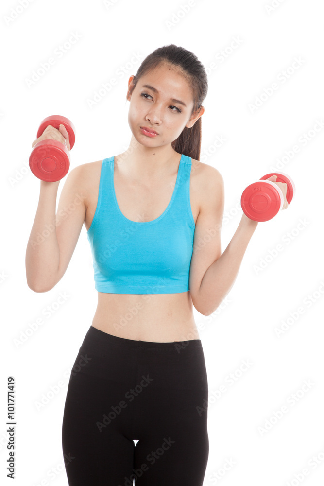Tired Asian healthy girl exercise with dumbbell Tired Asian healthy girl exercise with dumbbell