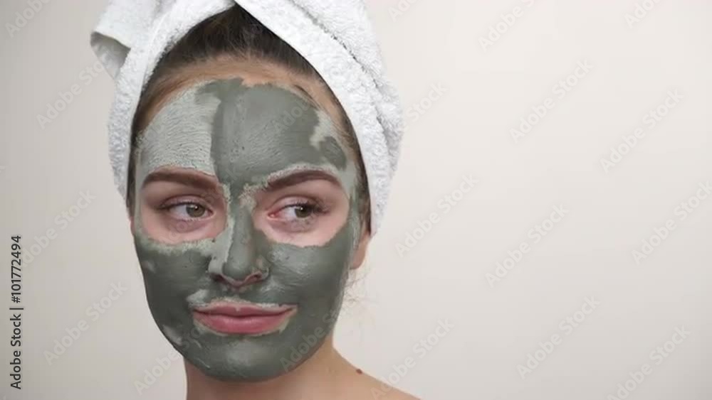 Woman with green clay mud mask on face 4K Woman with green clay mud mask on face 4K