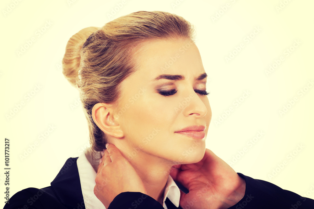 Businesswoman having huge neck ache StockFoto Adobe Stock