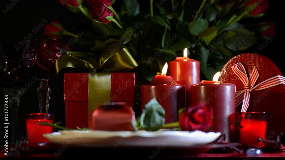 Romantic Valentine table setting with candle light and roses with focus on candles. Romantic Valentine table setting with candle light and roses with focus on candles.