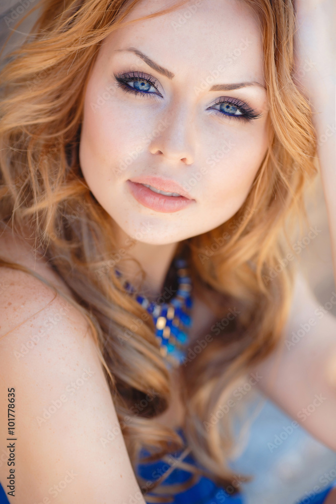 Summer portrait of beautiful red-haired woman. Summer portrait of beautiful red-haired woman.
