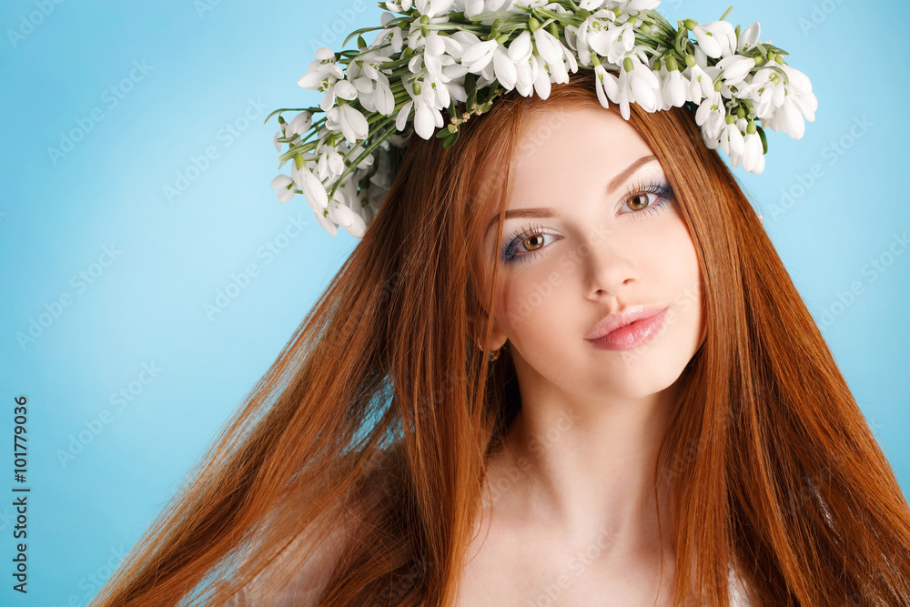 Studio portrait of a girl in wreath of flowers Studio portrait of a girl in wreath of flowers