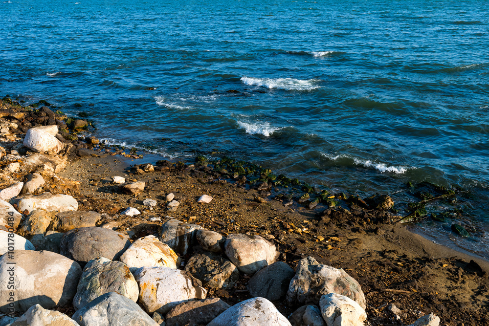 Big stones on seashore. Surf and waves Big stones on seashore. Surf and waves