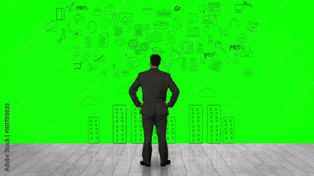 Businessman looking at green interface Businessman looking at green interface