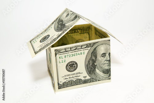 US dollar banknotes on display in the shape of a house on over w