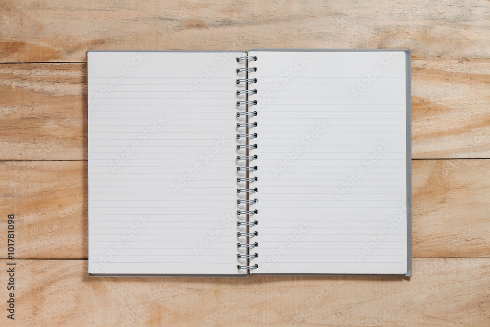 notebook on wood table notebook on wood table
