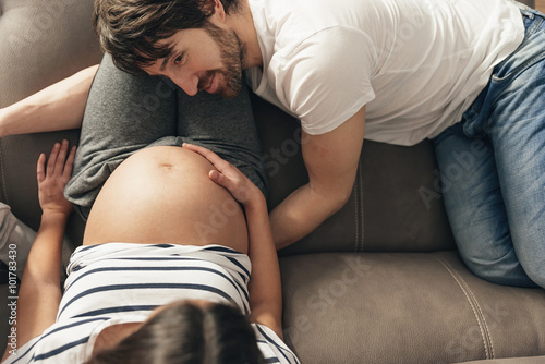 Mother and father waiting their newborn baby. photo