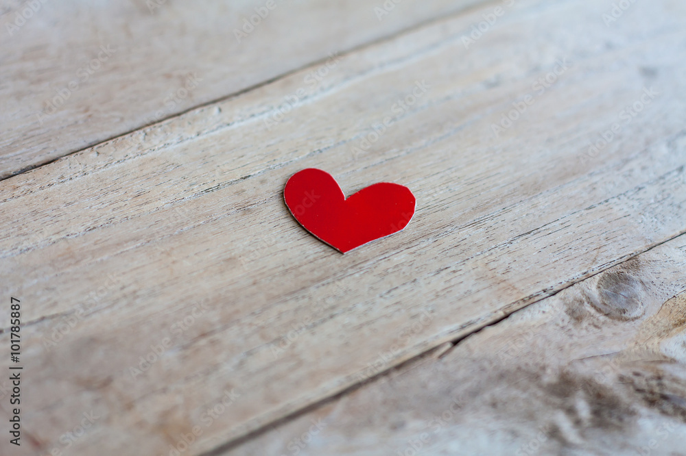 Red paper with heart shape on grunge wooden background Red paper with heart shape on grunge wooden background