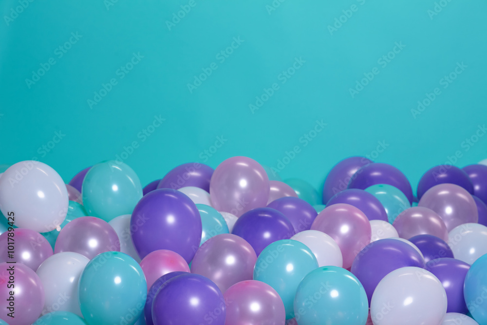 turquoise background with balloons