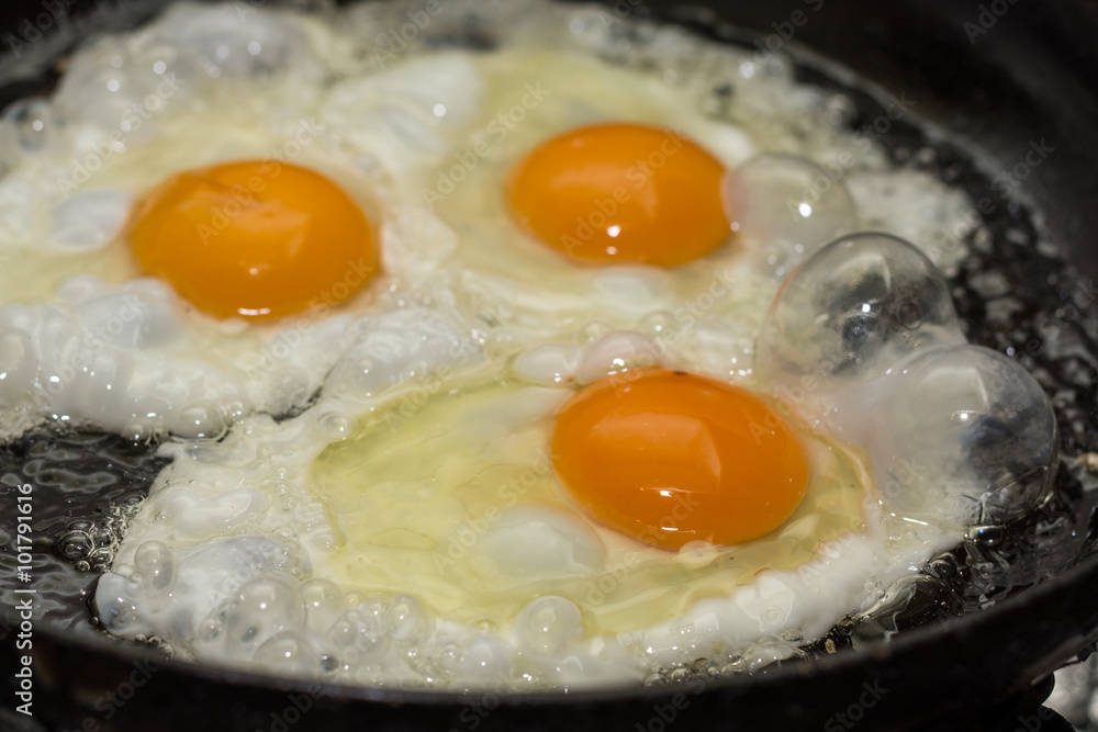 Three eggs frying in the hot oil Three eggs frying in the hot oil
