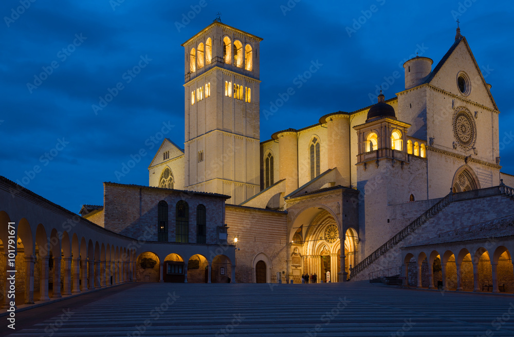Famous Basilica of Saint Francis of Assisi with Lower Plazain night. Assisi, Umbria, Italy