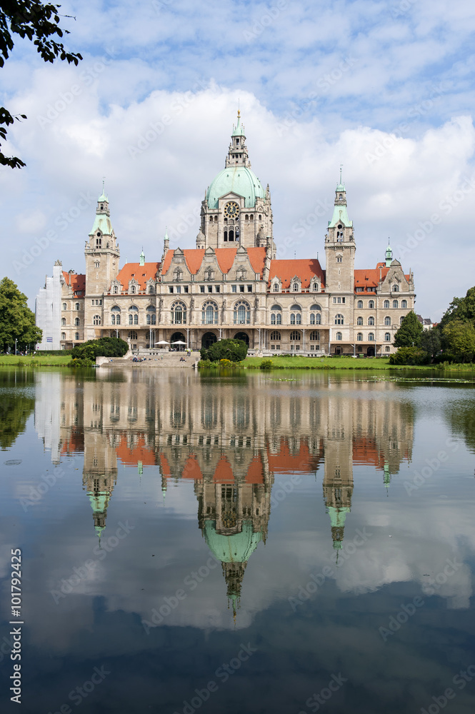 Reflection in lake of City hall in Hanover at summer day