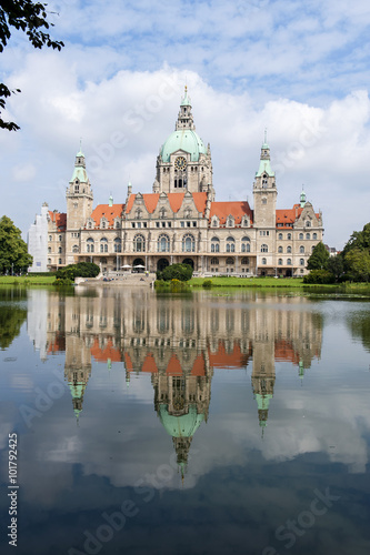Reflection in lake of City hall in Hanover at summer day