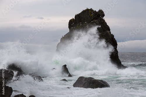 Powerful surf beating against the cliffs into the sea. The Sea of Okhotsk. Koni peninsula. Magadan Region. Russia.