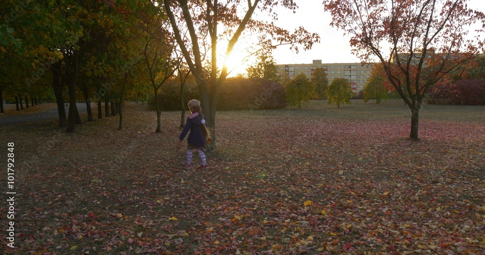 Little Girl in Beret And Blue Jacket is Walking at the Park Tracking ...